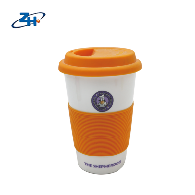 Promotional Ceramic travel mug with silicone lid and silicone removable part